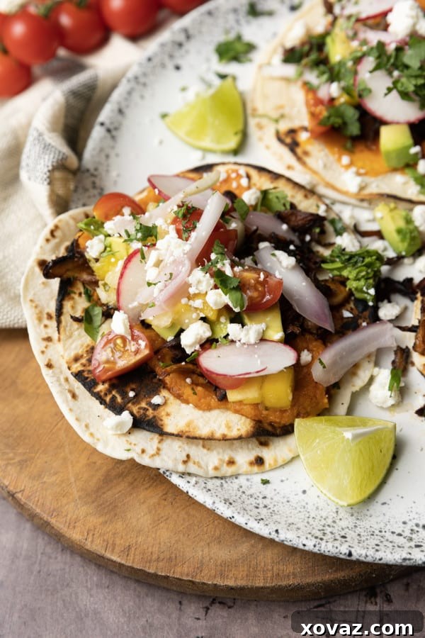 Sweet Potato Chili Delight 4 Crispy Mushroom Tacos served with a side of creamy mashed spicy sweet potatoes, showcasing versatile meal pairing.