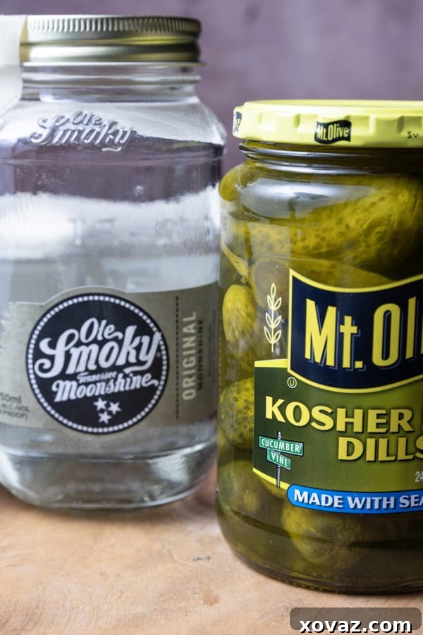 The journey of moonshine, from its illicit origins in hidden stills to its modern-day legal production. Learn about its corn-based composition and its transformation into various flavored varieties, including the base for our Moonshine Pickles.