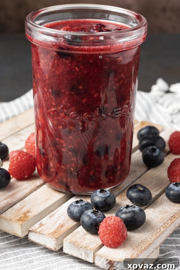 All the simple tools needed to make berry compote laid out on a kitchen counter.