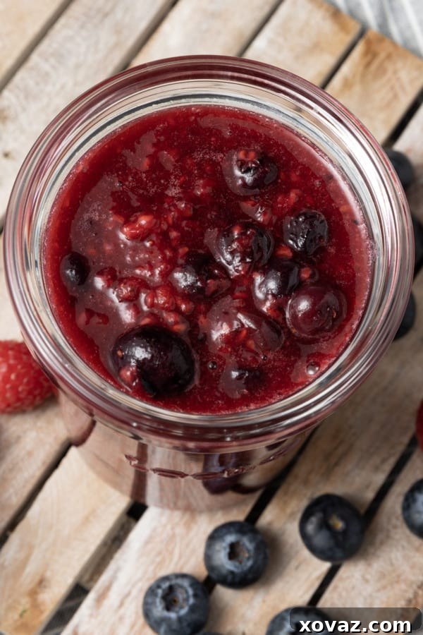 Berry compote stored in a jar, ready for future use or to be served as a topping.