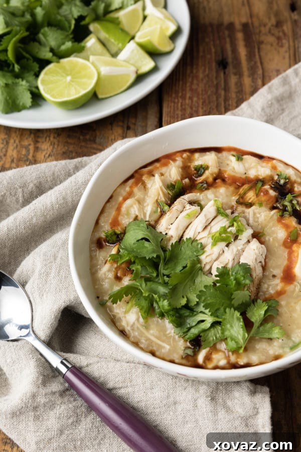 Assorted ingredients laid out for making Chao Ga, including chicken, rice, ginger, garlic, and green onions.