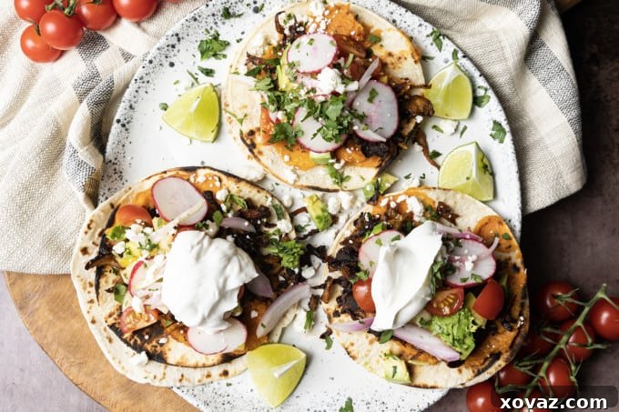 Kitchen tools and equipment laid out for preparing mushroom tacos, including a chef's knife, cutting board, and tongs.