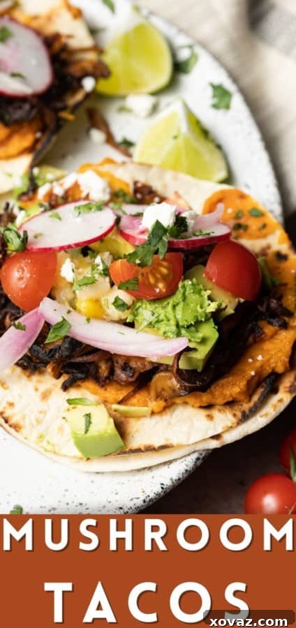 A vibrant, close-up shot of a single crispy mushroom taco, showcasing the rich filling and fresh, colorful toppings.