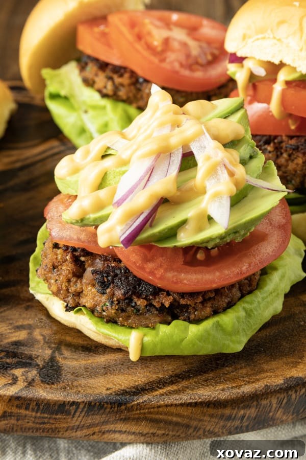 A perfectly cooked Black Bean Quinoa Burger, with a crispy exterior and tender interior, served on a bun.