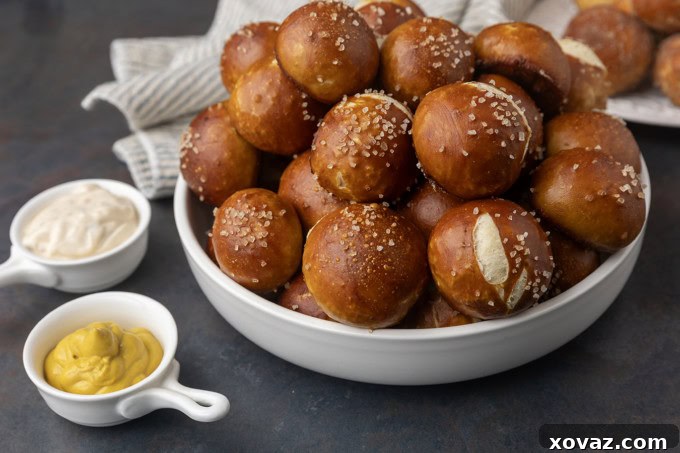 Tangy Sourdough Pretzel Bites 6 A bowl filled with pretzels and mustard.