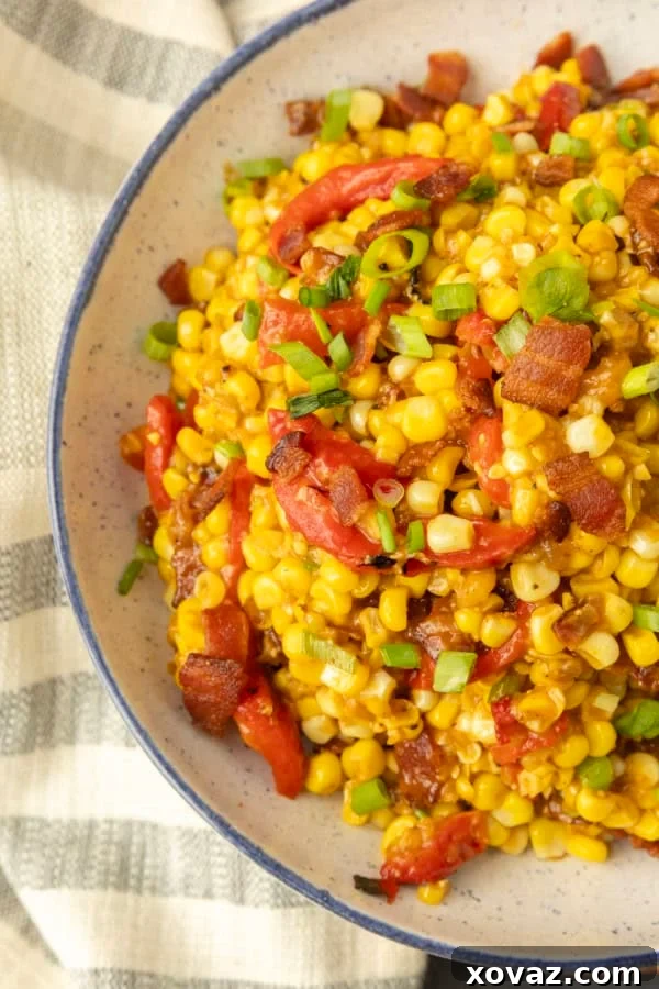Skillet-Fried Sweet Corn 4 fried sweet corn with bacon, green onions and roasted red peppers in a bowl