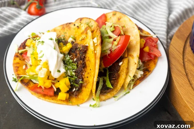 Crispy Smash Tacos 7 A stack of golden-brown, perfectly crispy smashed tacos, ready to be adorned with toppings.