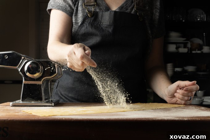 Mastering Fresh Pasta from Scratch 12 Hand-rolled pici pasta on a surface.