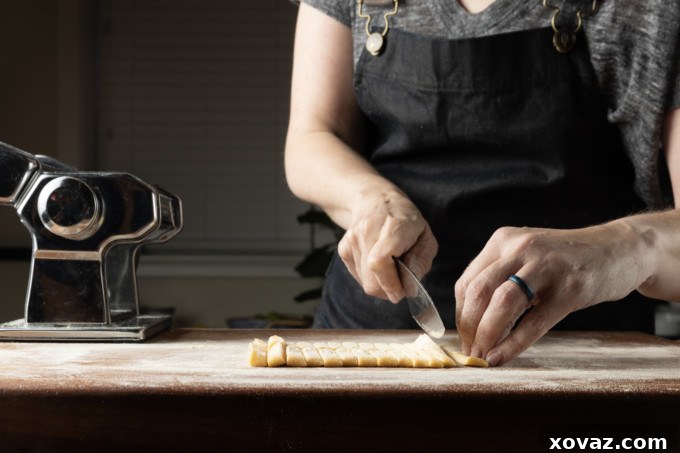 Mastering Fresh Pasta from Scratch 15 Fresh tagliatelle pasta strands dusted with flour.