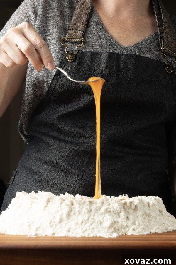 Mastering Fresh Pasta from Scratch 8 Pasta dough wrapped in plastic wrap, resting.