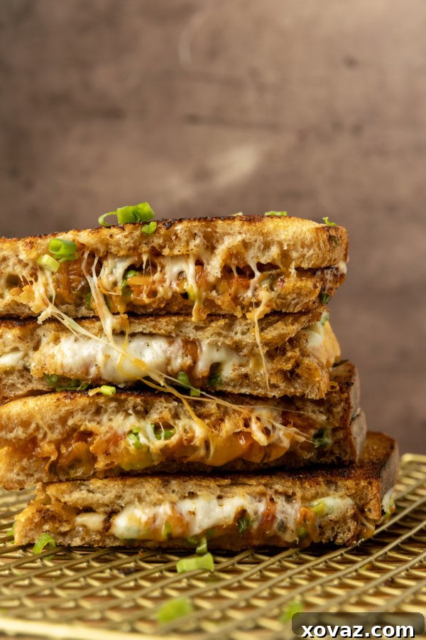 Kimchi grilled cheese on a plate, with a close-up of the melted cheese.