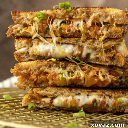 Stack of kimchi grilled cheese on a cooling rack.
