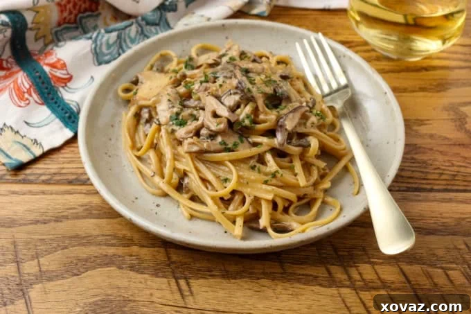 miso mushroom pasta on a plate with a fork