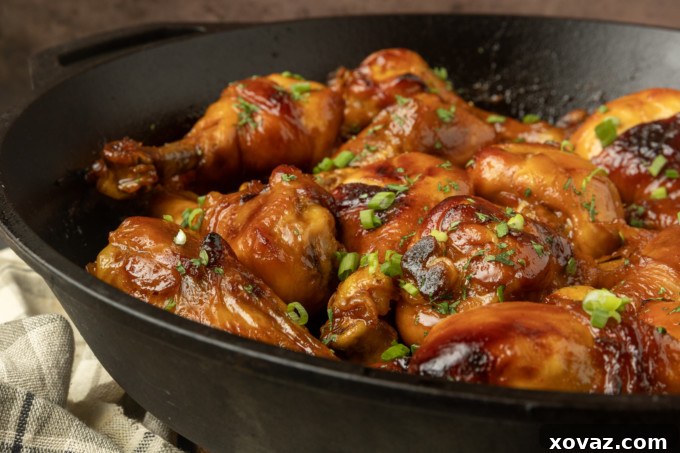 Honey-Glazed Garlic Chicken 2 baked honey garlic chicken in a cast-iron pan