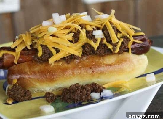 A fully loaded homemade chili dog, showcasing the bun's ability to hold generous toppings without breaking apart.