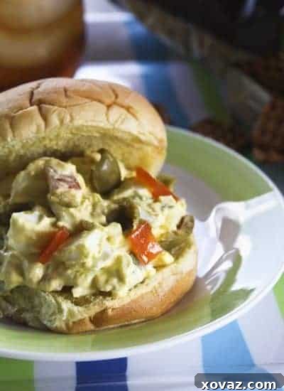 Ingredients for making egg and olive salad: hard-boiled eggs, green olives, mayonnaise, and seasonings.