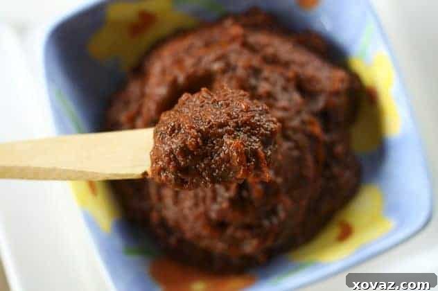 Slow-Cooker Pizza Sauce: Deep, rich red and packed with herbs, garlic, olive oil and Italian cheese, this old-school pizza sauce will knock your socks off.