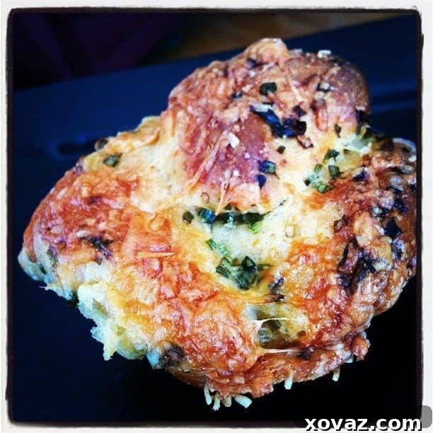 Baked Mini Cheddar Scallion Monkey Breads Baked mini cheddar scallion monkey breads cooling on a wire rack, golden and crusty