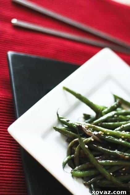 Freshly Prepared Garlicky Ginger Green Bean Stir Fry A close-up view of the perfectly cooked Garlicky Ginger Green Bean Stir Fry, garnished and ready for serving.