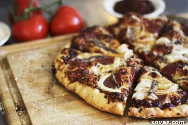 Homemade Whole Wheat Pizza A perfectly baked, golden-brown pizza crust made from whole wheat pizza dough, ready for toppings.