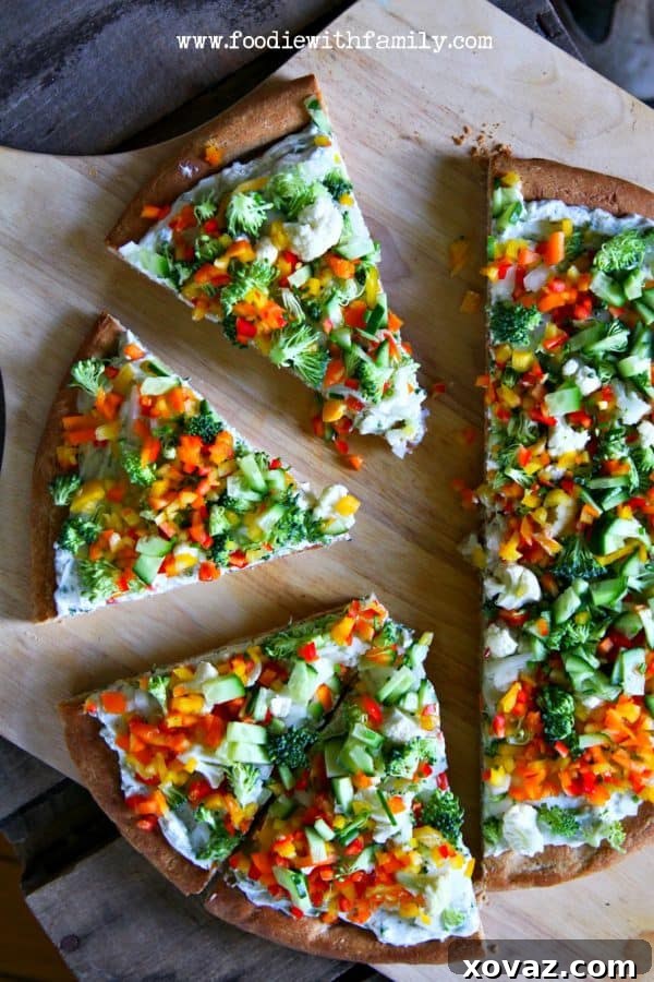 Easy No-Knead Whole Wheat Pizza Dough 4 Get your snack on with Snacky Ranch Cream Cheese Vegetable Pizza from foodiewithfamily.com. A vibrant, colorful pizza on a whole wheat crust.