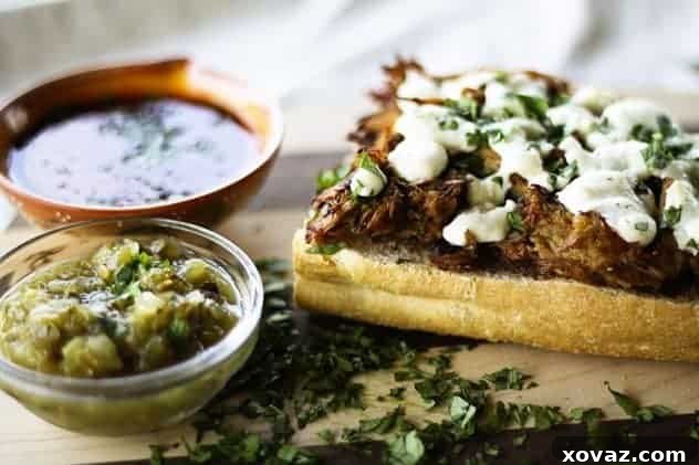Sweet Fig and Savory Pork Mexican Molletes 2 Pork and Fig Molletes prepared on a baking sheet, showcasing the ingredients before cooking, ready for the oven or grill.