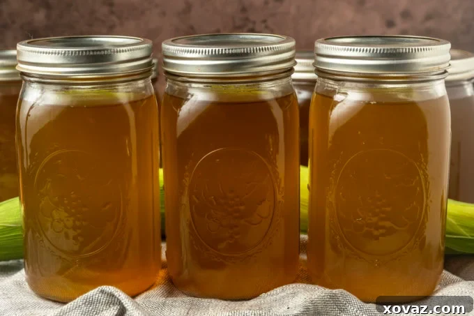 Harvested Bounty 7 Close-up of golden corn stock in a glass jar, alongside a freshly cooked ear of sweet corn, emphasizing the connection to fresh ingredients.
