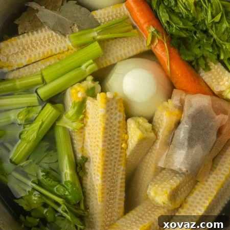 Harvested Bounty 8 corn cobs and vegetables in a stockpot to make corn stock