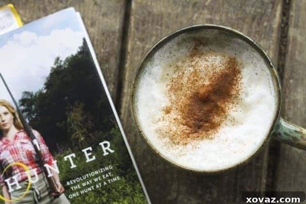 A side view of a Dirty Chai, showcasing its layered appearance and creamy froth.