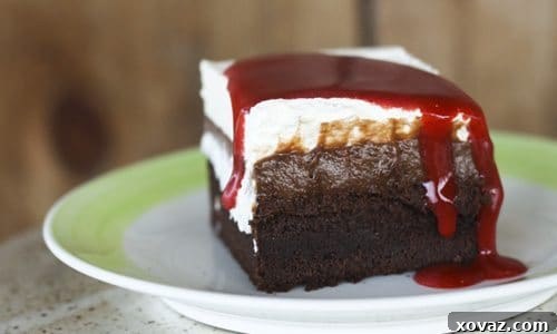 Close-up of Zombie Apocalypse Tres Leches Cake showing layers of cake, pudding, cream, and sauce