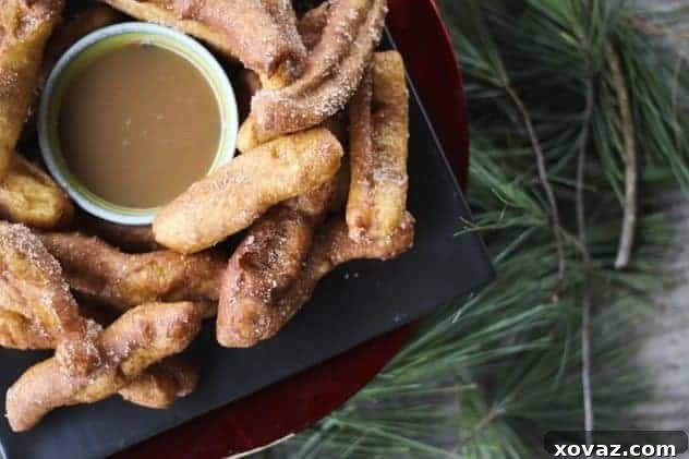 Delicious Banana Churros with Butter Rum Caramel Dipping Sauce served at a festive party table