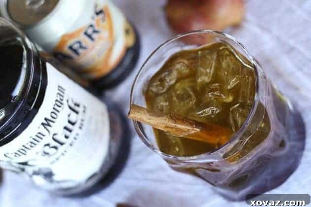 Guests enjoying Dark & Stormy Orchard cocktails at a festive gathering