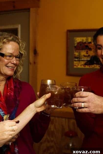 Friends raising glasses, toasting to a Captain Morgan party