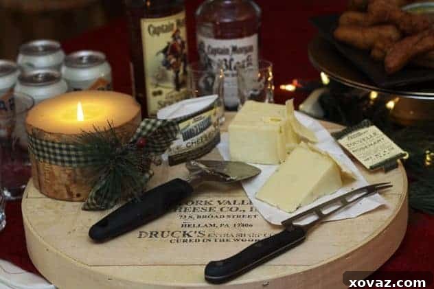 Assortment of cheese, beverages, and Banana Churros arranged on a party table