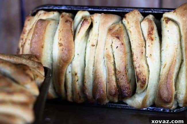 Ranch Bake-In-Slices Bread in the loaf pan, showing the pull-apart layers.