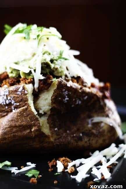 Midwestern Taco Loaded Potatoes 2 A hearty Midwestern Taco, loaded with delicious toppings, ready to be enjoyed.