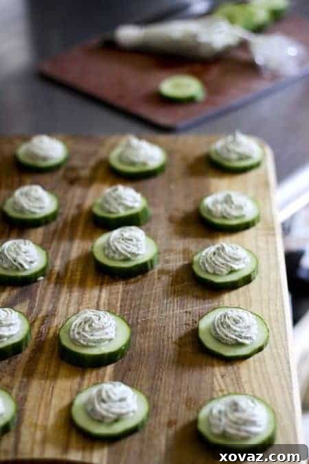 Fresh Cucumber Herbed Cream Cheese Bites 2 Crisp cucumber rounds topped with fresh herbed cream cheese, a refreshing and easy summer appetizer recipe from Foodie with Family.