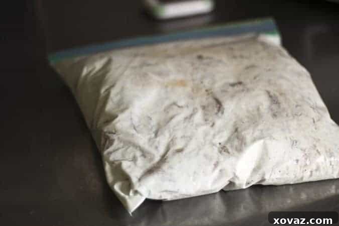 Chicken marinating in Greek yogurt and spices