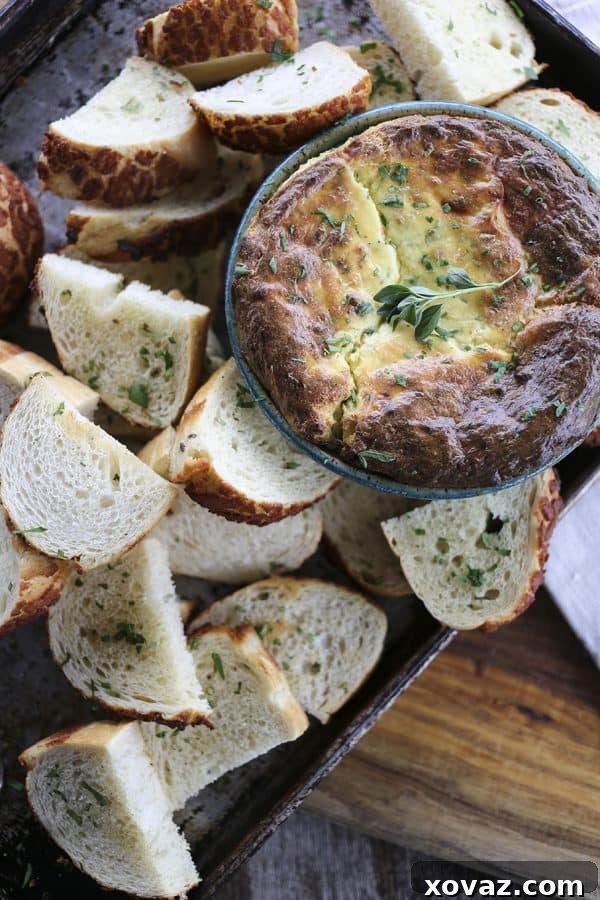 A close-up of the Baked Ricotta Appetizer, showcasing its light, airy texture and golden crust.