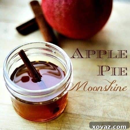 Apple Pie Moonshine in a mason jar, a delicious homemade fall drink.