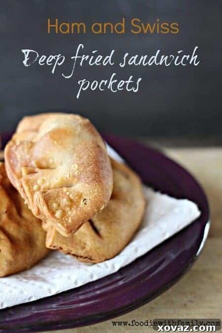 Crunchy Ham and Swiss Pockets Made for Mondays 2 Crispy Deep Fried Ham and Swiss Pockets, golden brown, served with grainy mustard, Dijon mustard, and horseradish sauce, ideal for game day snacks or party appetizers.