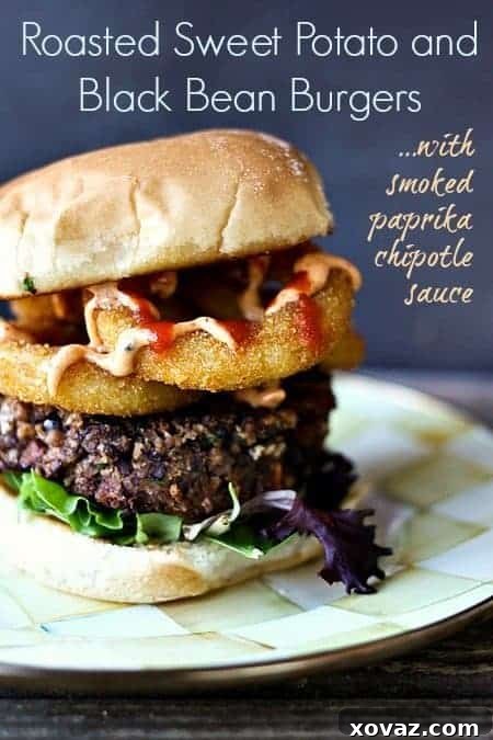 Hearty vegetarian black bean burgers infused with roasted sweet potatoes, topped with a rich smoked paprika chipotle sauce.