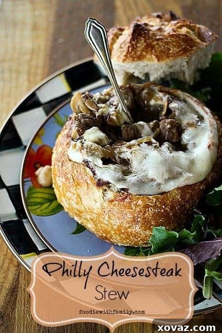 Ultimate Philly Cheesesteak Stew 2 Hearty Philly Cheesesteak Stew served in golden sourdough bread bowls, perfect comfort food.
