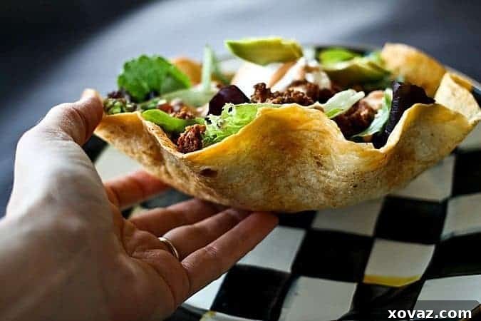 Mega Taco Salad served in a crispy Cool Ranch Baked Tortilla Bowl