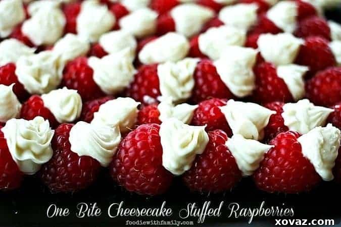 One Bite Cheesecake Stuffed Raspberries with Chambord. Fresh raspberries filled with a creamy, rich cheesecake and a hint of raspberry liqueur, perfect for a quick and elegant dessert. Ideal for parties or a special treat.