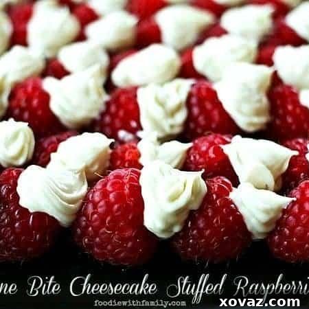 One Bite Cheesecake Stuffed Raspberries with Chambord foodiewithfamily.com #cheesecake #Dessert