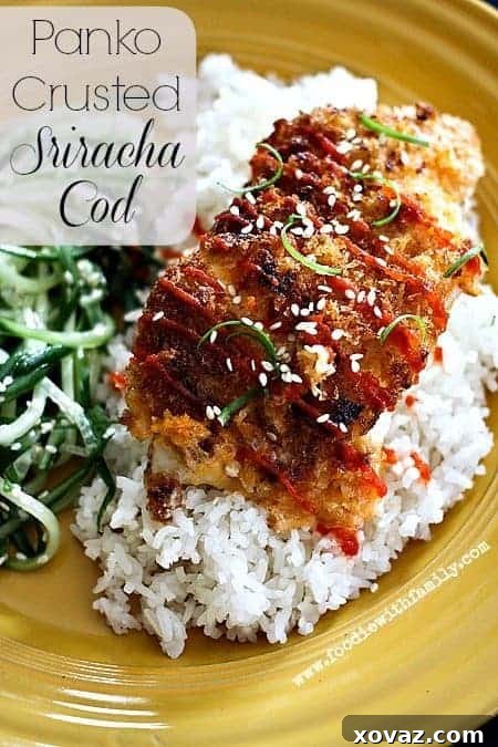 Crispy Panko Crusted Sriracha Cod fillet on a serving plate, garnished with green onions and sesame seeds