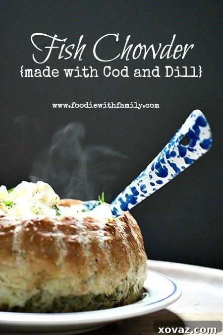 A close-up shot of creamy Cod and Dill Fish Chowder, highlighting the tender fish, potato pieces, and fresh dill, ready to be savored.