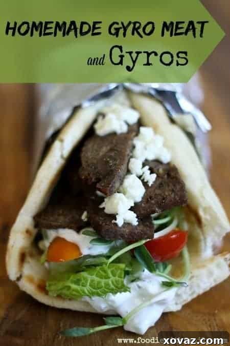 Mastering Homemade Gyro Meat and Sandwiches 5 Two perfectly assembled homemade gyros, wrapped in foil, ready to be enjoyed with a side of fresh ingredients.