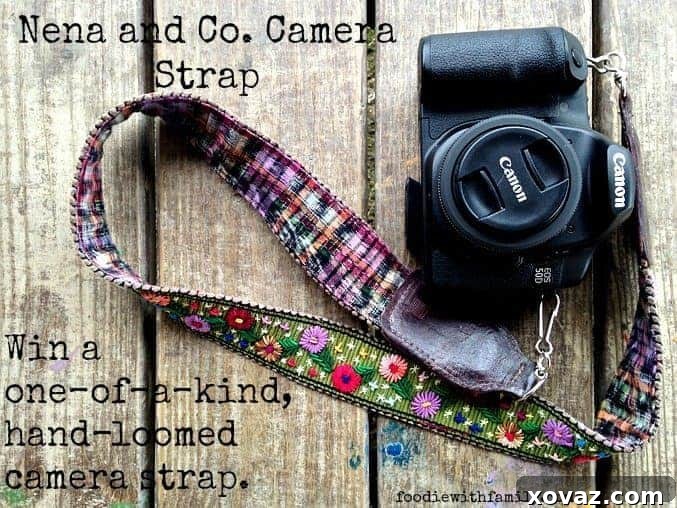 Nena & Co. one-of-a-kind, hand-loomed camera strap with genuine leather trim. Experience unique style and comfort with ethical fashion.